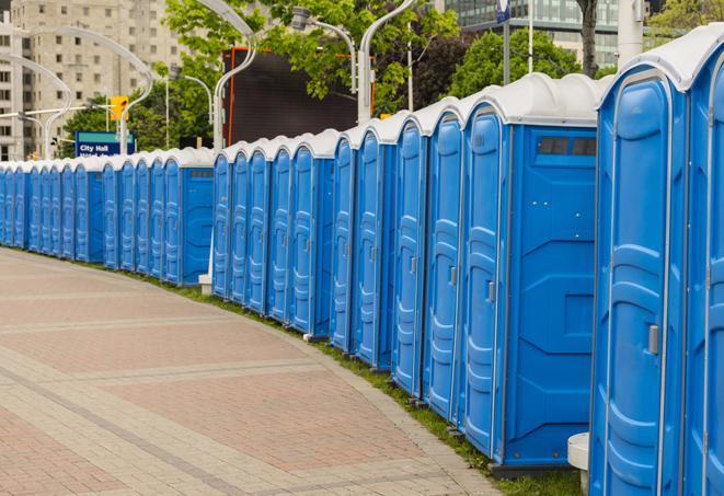 hygienic portable restrooms lined up at a music festival, providing comfort and convenience for attendees in Marine, IL